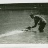 Michigan Participation - Man with model boat in water
