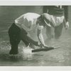 Michigan Participation - Man with model boat in water