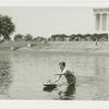 Michigan Participation - Man with model boat in water