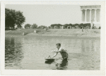 Michigan Participation - Man with model boat in water