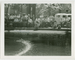Michigan Participation - Crowd watching model boat in water