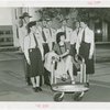 Michigan Participation - Willo Sheridan (Miss Michigan Aviation) - In chair surround by Fair policemen and policewomen