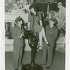 Michigan Participation - Willo Sheridan (Miss Michigan Aviation) - Sitting on top of airplane engine looking down on two pilots