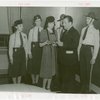 Michigan Participation - Willo Sheridan (Miss Michigan Aviation) - Presenting letter of introduction to Grover Whalen while Fair policemen and policewomen look on