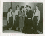 Michigan Participation - Willo Sheridan (Miss Michigan Aviation) - Presenting letter of introduction to Grover Whalen while Fair policemen and policewomen look on