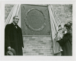 Moses, Robert - In front of plaque dedicated to Henry Lutz