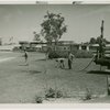 Mosquito protection and control - Men spraying insecticide into water