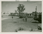 Mosquito protection and control - Men spraying insecticide into water