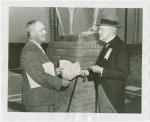 Netherlands - Neil van Aken and Cornelius Kouwenhoven looking at historic deed