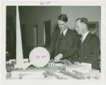 New England Participation - Dudley Harmon and Leslie Baker looking at Fair model