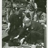 New York City - Police Dept. - Policeman giving man oxygen