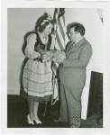 New York State - Woman presenting Fiorello LaGuardia with onions