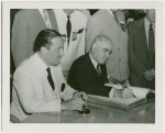 New York State - Lehman, Herbert H. (Governor) - Signing guestbook with Grover Whalen