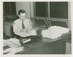 New York World's Fair - Employees - Man bundling letters