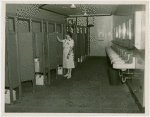 New York World's Fair - Employees - Restroom matron cleaning stall