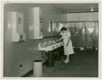 New York World's Fair - Employees - Restroom matron cleaning sink