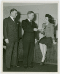 New York World's Fair - Employees - Woman giving check for Greater New York Fund to Harold Dean while Vincent Pach looks on