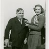 New York World's Fair - Employees - Bakers - Woman pins Fiorello LaGuardia with pin denoting him dunking expert