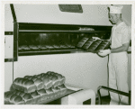 New York World's Fair - Employees - Bakers - Baker removing bread from oven