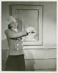 New York World's Fair - Employees - Females - Woman standing in front of Trylon and Perisphere picture