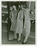 New York World's Fair - Employees - Females - Women in Banking Department looking in mirror