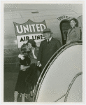New York World's Fair - Employees - Gibson, Harvey (Chairman of Board) - On airplane stair with women