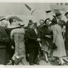 New York World's Fair - National Advisory Committees - Women's Participation - Women getting off airplane greeted by Fiorello LaGuardia, Harvey Gibson and Mrs. Oswald B. Lord