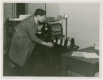 New York World's Fair - Offices at Work Exhibit - Printing - Employee at mimeograph machine