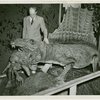 New York Zoological Society - Man next to alligator in exhibit