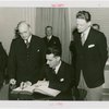 New Zealand Participation - Robert Firth (Commissioner General) signing contract with Harvey Gibson
