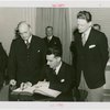 New Zealand Participation - Robert Firth (Commissioner General) signing contract with Harvey Gibson