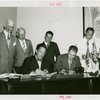 Nicaragua Participation - Noel Ernesto Pallais (Consul General) and Grover Whalen sign contract as group looks on