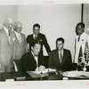 Nicaragua Participation - Noel Ernesto Pallais (Consul General) and Grover Whalen sign contract as group looks on