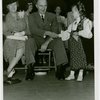 Norway Participation - Wilhelm Morgenstierne shaking hand of girl in costume