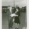 Ohio - Harold Burton (Cleveland mayor) and woman with good-will packet