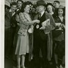 Opening Day - 1940 Season - Woman pinning ""Hello Folks"" label on man
