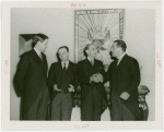 Peru Participation - Peruvian officials and Grover Whalen in front of Coat of Arms
