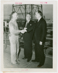 Petroleum - Oil Industry official and derrickman shake hands