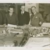 Poland Participation - Antoni Milkowski (Assistant Commissioner), Count Janusz Illinski and Albin Johnson look at model