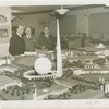 Poland Participation - Antoni Milkowski (Assistant Commissioner), Count Janusz Illinski and Albin Johnson look at model
