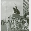 Poland Participation - Women in traditional dress in front of statue of King Jagiello