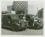 Poland Participation - Women in traditional dress sitting on ambulances