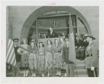 Portugal Participation - Women in traditional dress, officials, and Grover Whalen in front of building