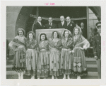 Portugal Participation - Women in traditional dress officials, and Grover Whalen speaking in front of building