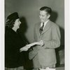 Press Events - Associated Press - Man handing woman envelope