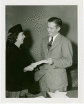 Press Events - Associated Press - Man handing woman envelope