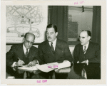 Puerto Rico Participation - Grover Whalen, Fenrnando J. Geigel (Director of Agriculture and Commerce) and Jose Matienzo signing contracts