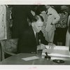 Puerto Rico Participation - Blanton Winship (Governor General) signing guest register