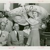 Puerto Rico Participation - Woman putting hat on Blanton Winship (Governor General)