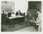 Radio Corporation of America (RCA) - Lenox R. Lohr (President of National Broadcasting Company), David Sarnoff and (President of RCA) and Grover Whalen signing contracts while being filmed for television